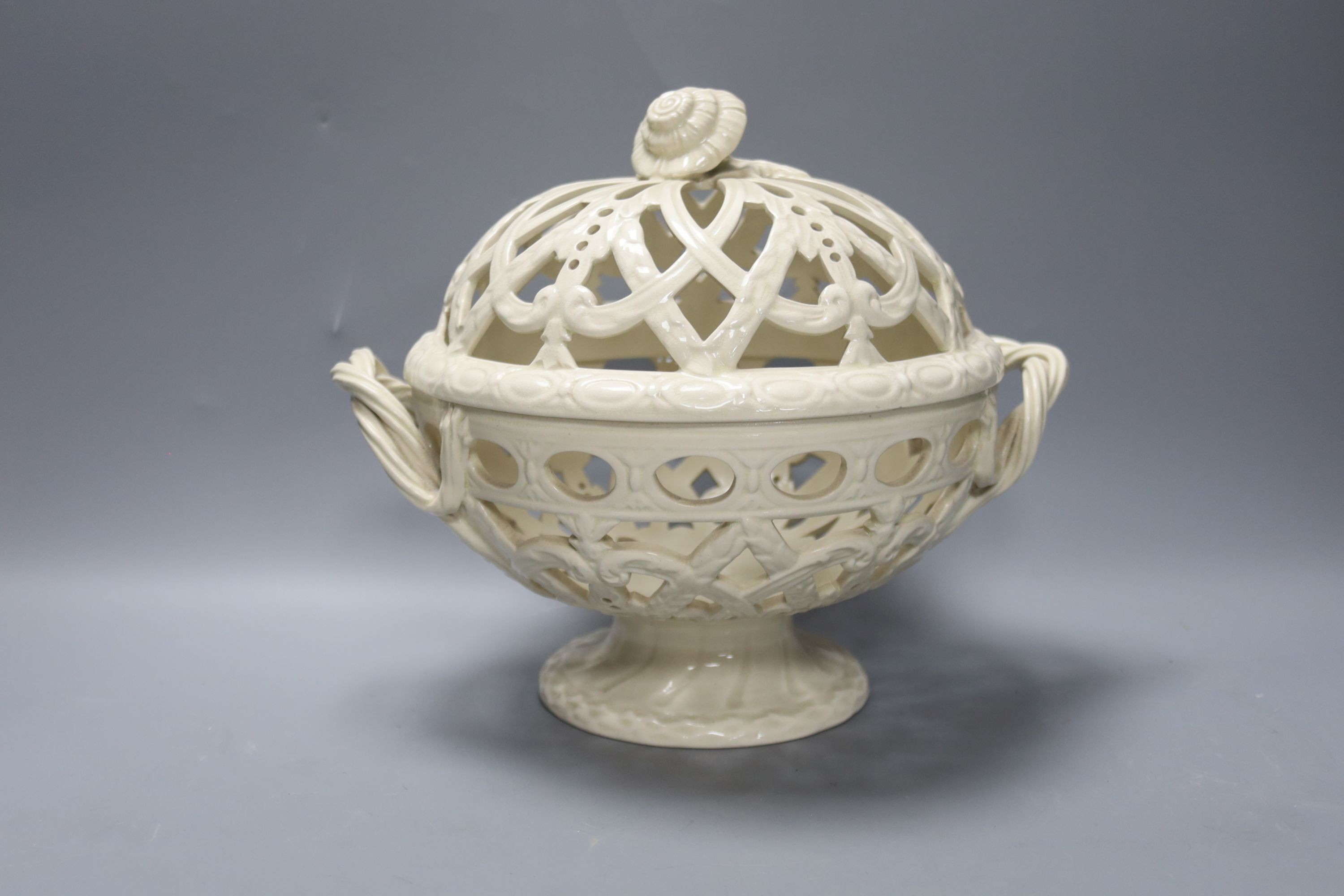 A Victorian Wedgwood creamware covered basket and two Continental creamware baskets, 22cm